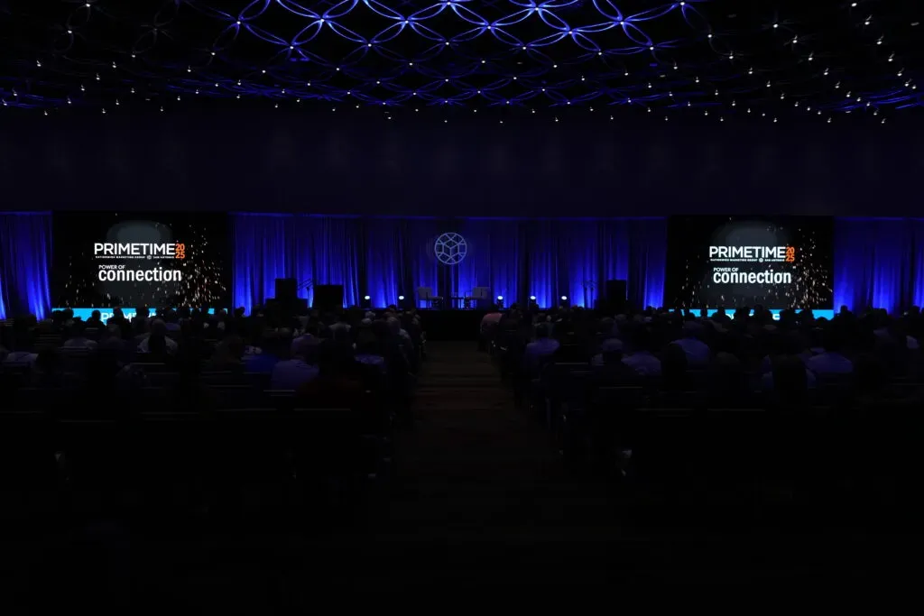 Dark auditorium filled with people